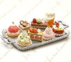 miniature cakes and pastries on a silver tray