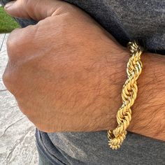 Mens twisted braided rope chain bracelet. Measures 9" inches long x 10mm thick. 14k gold plated finish over alloy metal. Nice weight to it at approx 40 grams. Stylish and secure lobster claw clasp. Looks like a $1000 solid gold piece. 100% FREE SHIPPING in USA. Order now! Gold Rope Chain Bracelet, Adjustable Gold Rope Chain Bracelet, Braided Rope, Twist Braids, Gold Piece, Rope Chain, Lobster Claw, Chain Bracelet, Solid Gold