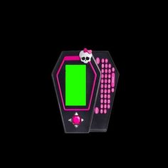 an electronic device with a green screen in the shape of a skull sitting on top of it