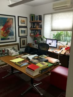 a desk with many books on top of it