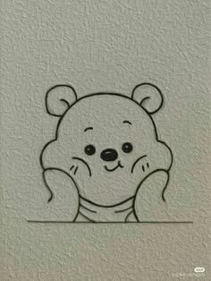 a drawing of a teddy bear sitting on top of a white wall with black outline