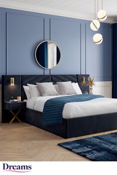 a bedroom with blue walls, white bedding and wooden floors is pictured in this image