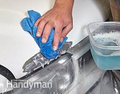 a man is washing his hands with a blue cloth