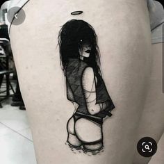 a woman's thigh with a black and white drawing on it