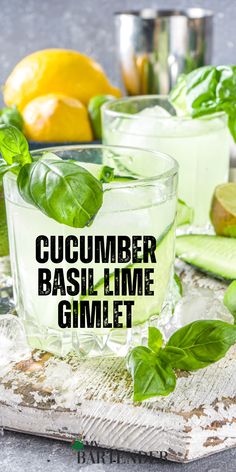 cucumber basil lime gimlet on a cutting board next to lemons