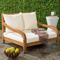 a wooden chair sitting on top of a stone floor