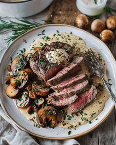 steak with mushrooms and gravy on a plate