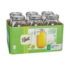 six glass jars filled with green liquid