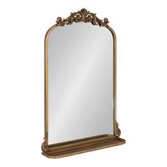 an ornate gold framed mirror on a white background