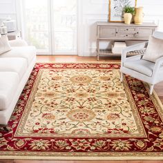 a living room filled with furniture and a rug