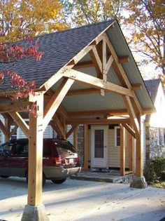 a car parked in front of a house with a covered porch and attached carport