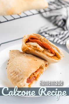 a close up of a sandwich on a plate with the words homemade calzone recipe