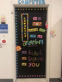 a classroom door decorated with colorful writing