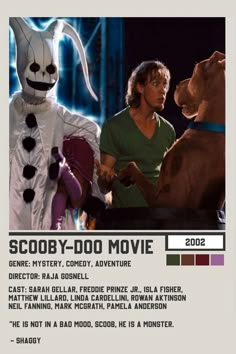 the scooby - doo movie poster is shown with two men and a dog