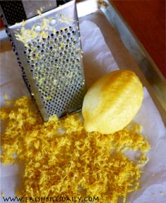 a grater is next to some yellow food