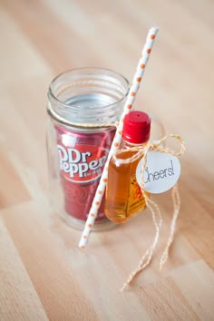 a jar filled with some kind of condiment next to a sign that says dr pepper's