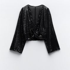 Zara Sequin Crop Top 69.90 Usd Top With Knotted V-Neckline And Long Sleeves. Sequin Appliqus. Black Outer Shell 93% Polyester 7% Elastane Make An Offer! Make It Yours! New! No Flaws. Great Condition. Never Worn/Used Bundle & Save 90% Of The Listed Items Are Never Worn/Used & With Tag Cute Adorable Cool Amazing Awesome High End Surprise Graduation Gift Valentine Bridesmaid Easter Mother's Day Valentine Christmas Wedding Birthday Baby Shower Best Friend Aunt Grandma Girl Spring Summer Fall Winter Black Sequin Crop Top, Bow Crop Tops, White Linen Blouse, Black Sequin Top, Chiffon Tops Blouses, White Shirt Blouse, Glam Tops, Lace Trim Shorts, Sequin Crop Top