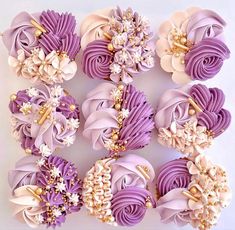 purple and white flowers are arranged in rows on a white surface with gold trimmings