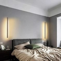 a large bed sitting in a bedroom next to two lamps on either side of it