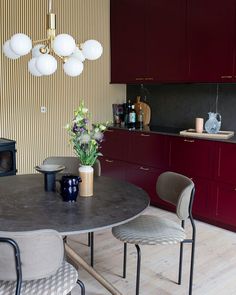 a dining room table with four chairs around it