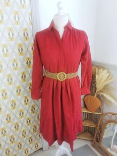 A gorgeous, burgundy vintage shirt dress in a check textured woven jacquard fabric. This dress is a nice thickness for autumn and winter, and is 100% wool so will keep you warm! Has an elasticated waist.  Good vintage condition Approx modern UK size 12 Measures : pit to pit 44", waist 34-40", shoulder to shoulder 15", length from shoulder 41" Best way to check your measurements is to measure something that fits you well! Lie the garment flat, measure in inches and double the measurements. Bust - Red Vintage Button Front Dresses, Vintage Red Blouse With Button Closure, Vintage Red Button-up Dress, Vintage Christmas Party, Vintage Red V-neck Outerwear, Red Vintage Flannel Shirt With Button Closure, Vintage Shirt Dress, Wool Shirt, 70s Vintage