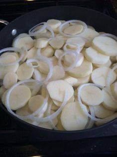 onions are being cooked in a pan on the stove