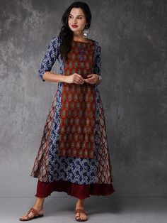 This beautiful maroon and blue printed A-line layered kurta with embellished and tassel detailing, has a round neck, three-quarter sleeves, flared hem, no slits, definitely a breathable and stylish kurta from India is a must-have item for any wardrobe. For your next dinner party or family gathering, this maroon piece pairs well with dark leggings and flats. Layered Kurta, Cotton Kurti Designs, Batik Print, Batik Prints, Stylish Dress Designs, Long Tunic, Thread Work, Kurti Designs