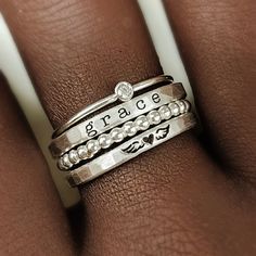 Mother's Day Gift | Personalized stackable ring set, engraved with a name, date, or special word.  Metal: 14 gold filled, 14k rose gold filled, or .999 fine silver Dimensions: name rings are 2mm tall on average, but our rings are handmade so variations will occur. The beaded ring is 2mm, and the birthstone is 2mm on a 1mm band Font: lowercase typewriter, lowercase cursive, or uppercase bold block. If you leave one name, we will engrave the heart/wings on the second ring. Unsure what size you nee Cheap Stackable Name Rings For Women, Adjustable Stackable Initial Ring, Customizable Adjustable Sterling Silver Engraved Ring, Adjustable Customizable Engraved Sterling Silver Ring, Adjustable Personalized Stackable Rings, Adjustable Engraved Stackable Ring For Everyday, Everyday Adjustable Stackable Engraved Ring, Adjustable Hand Stamped Rings For Everyday, Adjustable Hand Stamped Everyday Rings