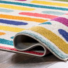 a multicolored area rug on the floor