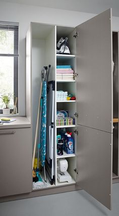 an organized closet in the corner of a room