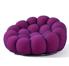 a purple chair that has many balls on it's back legs and arms in the shape of a ball