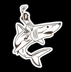 a woman riding on the back of a shark sticker