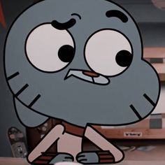 a cartoon character with big eyes sitting down