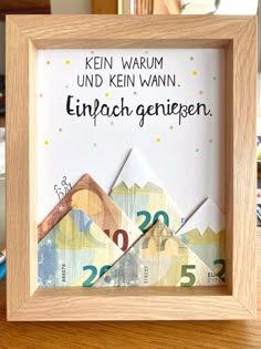 a wooden frame with an envelope and some paper on it that says, we're warm und kein warnn