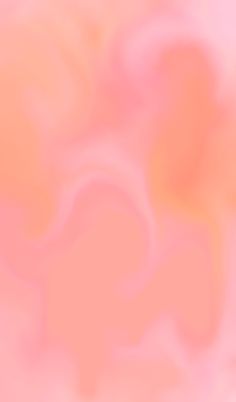 a blurry image of an orange and pink background