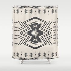 a black and white shower curtain with an abstract design