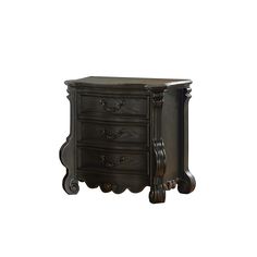 an antique style night stand with three drawers