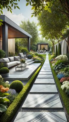 an outdoor garden is shown with grass and flowers in the foreground, along with couches and tables on either side