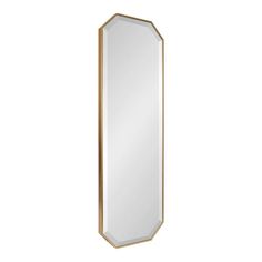 a mirror that is on the wall with a gold frame and an oval shaped body