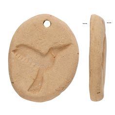 an image of a clay ornament with a bird on it's side