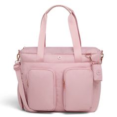 a pink handbag with two compartments on the front and one compartment in the back