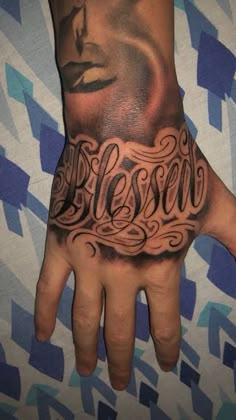 a person's hand with a tattoo on it and the word besow written in cursive writing