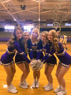 the cheerleaders are posing for a photo together