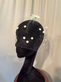 This is a charming, vintage veil with velvet bows & velvet dots. It is not labeled. It is a "One size fits all", designed to attach to your hair.   It is a single veil of mesh, chartreuse green netting. It is trimmed with small chartreuse green velvet bows on the top & back.  The netting is trimmed with little velvet dots on the sides & front. It is in good, vintage condition. The netting shows a few small breaks, please see photos.  No wear or tear. No soil or stains.   Charming! Vintage Spring Headband, Vintage Mini Hat Headband For Vintage Events, Vintage Fitted Headband For Vintage Events, Vintage Headband For Kentucky Derby, Vintage Evening Fascinator Headband, Vintage Kentucky Derby Mini Hat Headband, Vintage Headband For Church, Vintage Headband Fascinator For Church, Vintage Fascinator Headband For Church