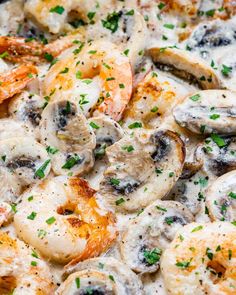 closeup of shrimp and mushroom pizza with parsley on the top, ready to be eaten