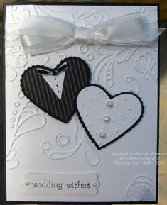 a card with two hearts and a bow on it