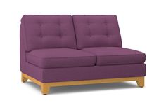 a purple couch sitting on top of a wooden frame