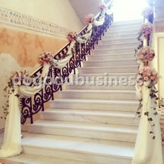 the stairs are decorated with flowers and ribbons