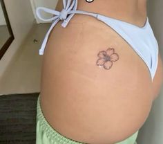 a woman's stomach with a flower tattoo on her belly and the words, what do you think?