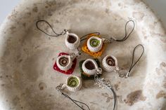 four crocheted items are sitting in a bowl